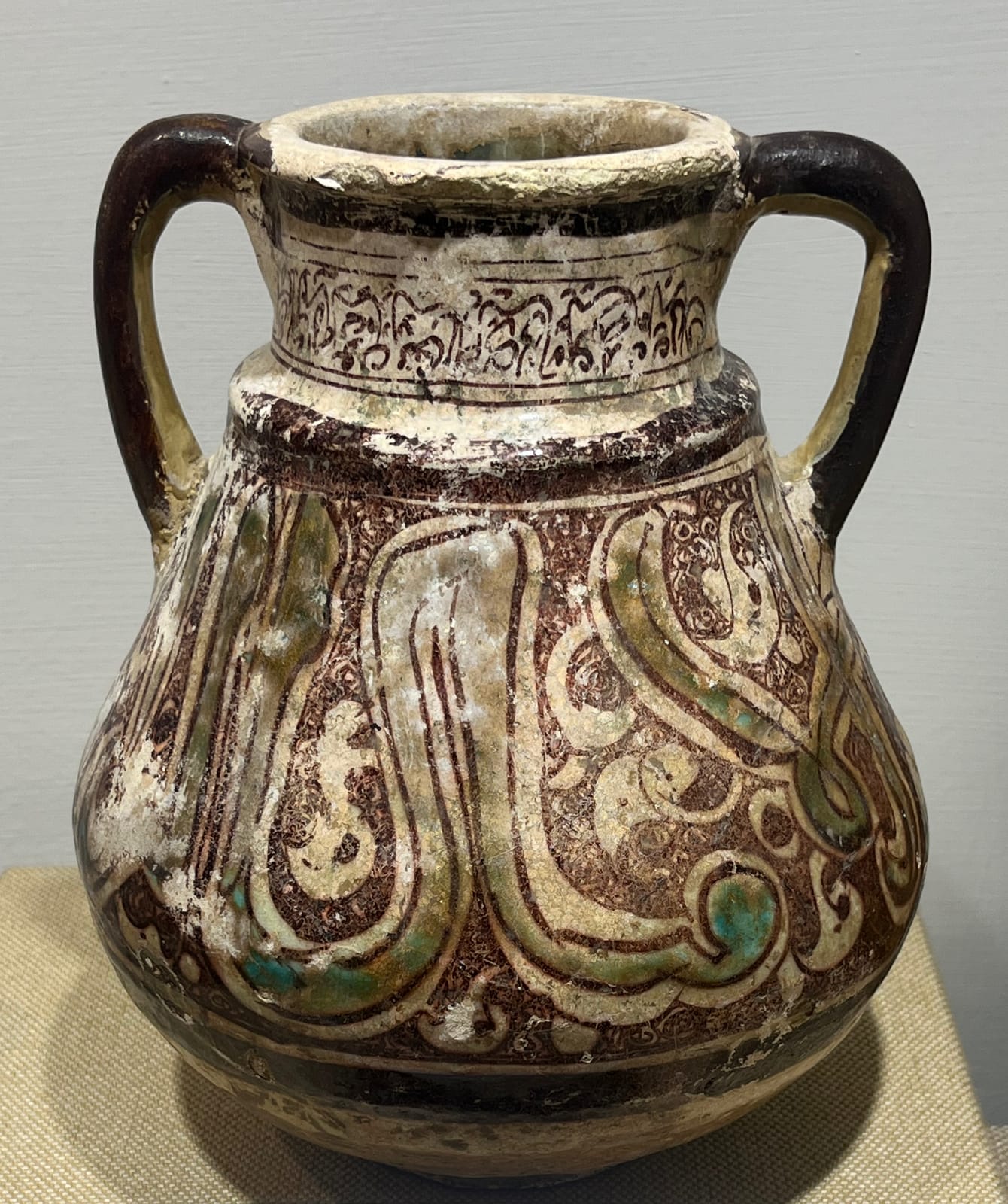 Glazed vase with Arabic calligraphy